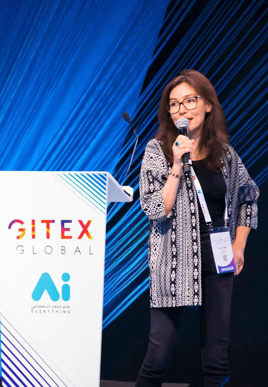 Elena Sinel speaking on stage at GITEX